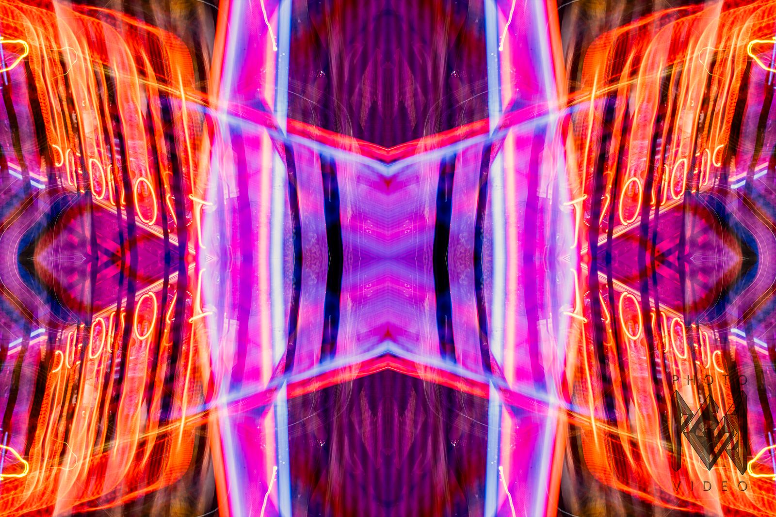 Orange, pink and violet neon trails mirrored four ways into a symmetrical pattern