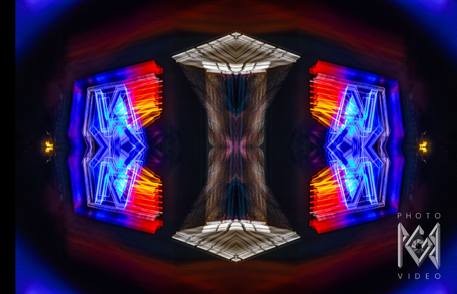 Blue and red neon shapes mirrored either side of a pale central column, ringed by dark blue glow