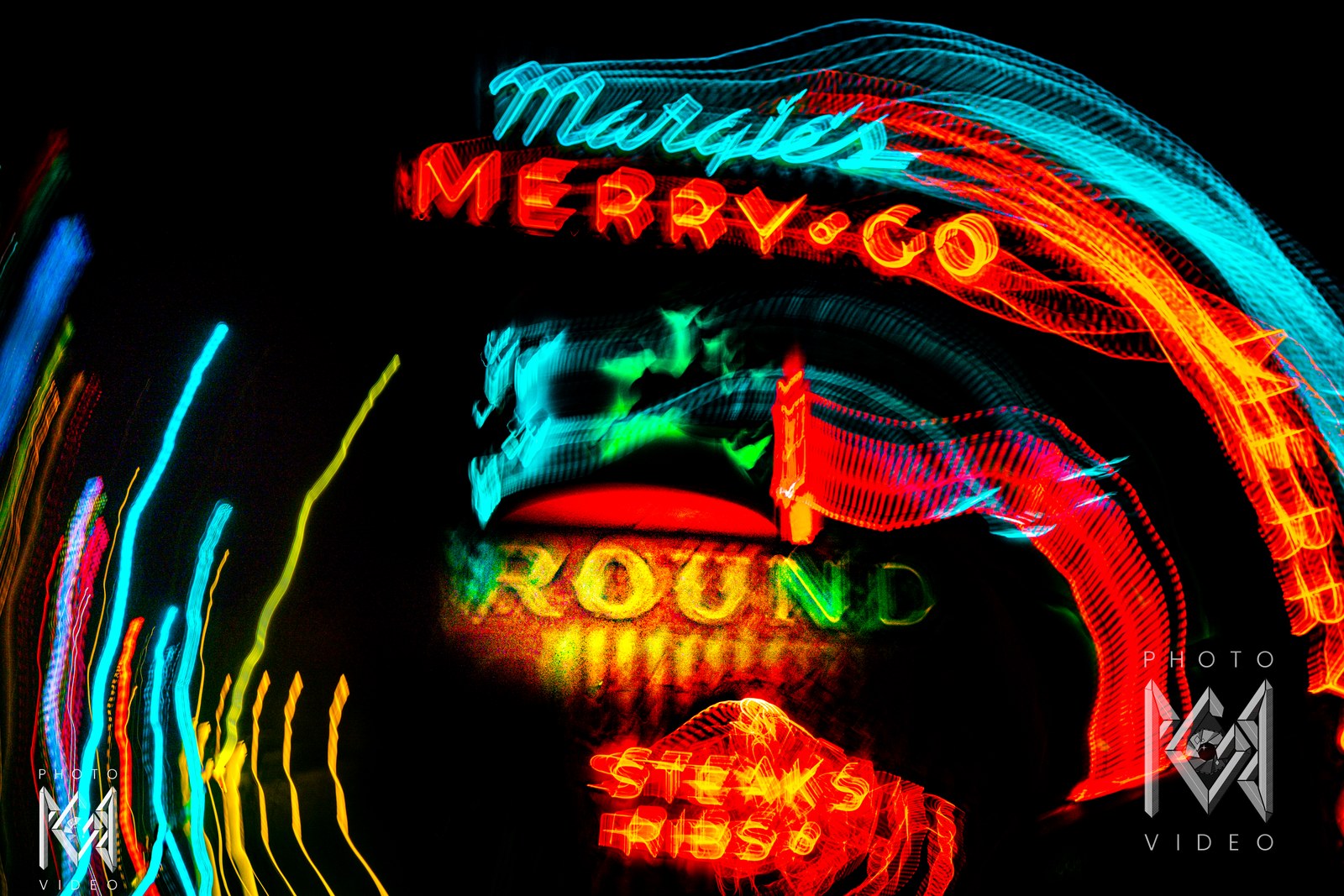 Margie's Merry-Go-Round neon sign in Lone Pine, cyan and red arcs of light sweeping over the lettering and STEAKS RIBS glowing below