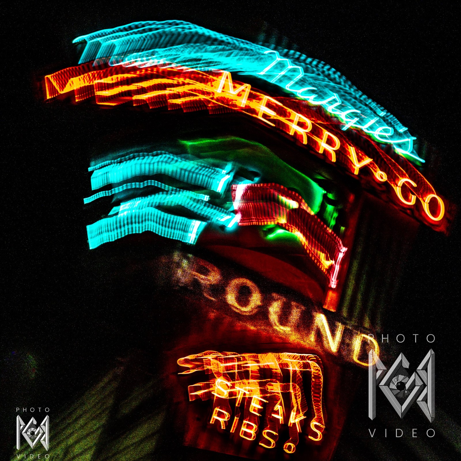 A twisting, tilted exposure of the Merry-Go-Round sign in Lone Pine, orange MERRY-GO and ROUND lettering beneath cyan script and STEAKS RIBS