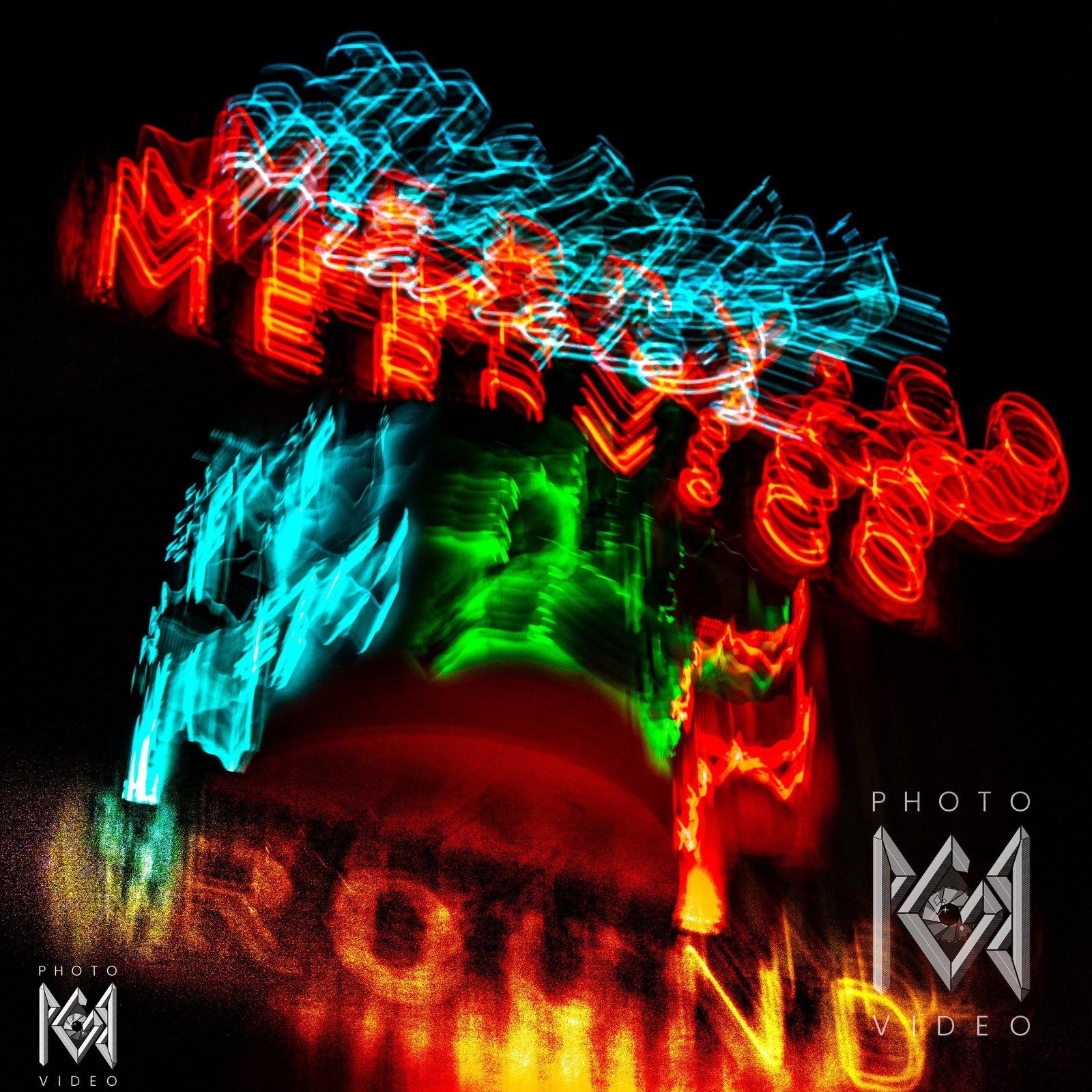 Abstract Merry-Go-Round neon in Lone Pine, red and cyan lettering smeared and spiralled, with green and cyan blurs above a grainy yellow ROUND