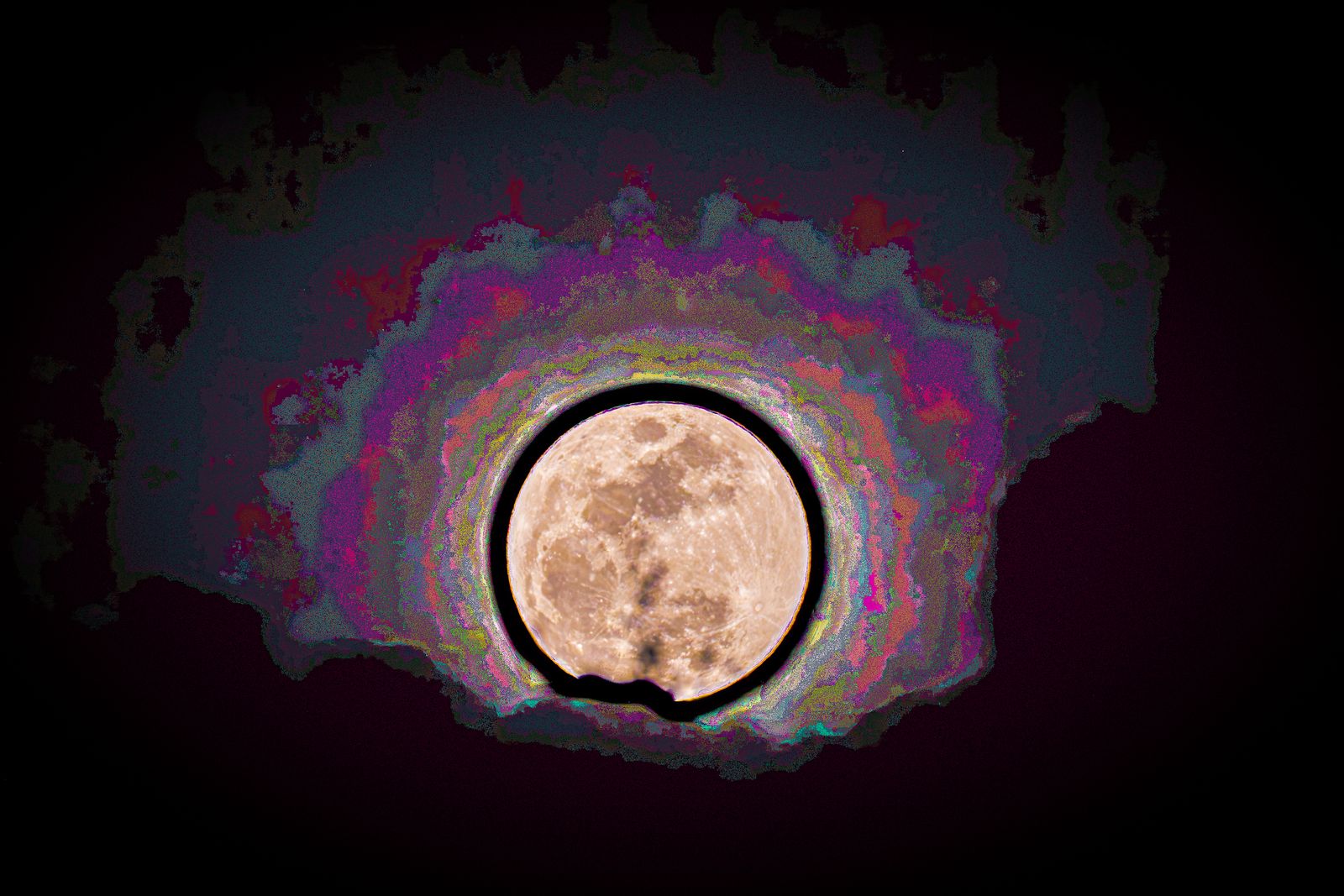 The full moon at the centre of a glowing, banded halo of magenta, violet and blue on black